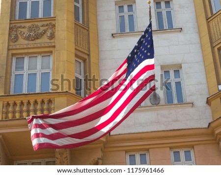 American flag waving in blue sky

