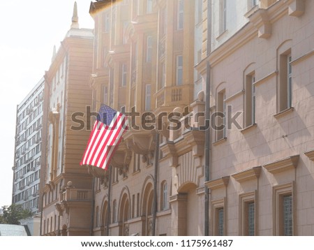 American flag waving in blue sky
