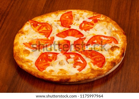 Pizza with chicken, cheese and tomato