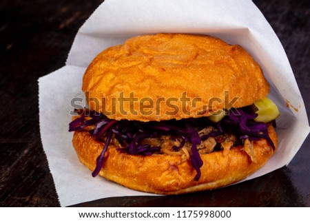 Burger with pulled pork and cabbage