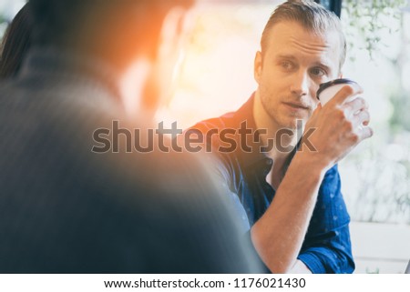 two smart caucasian man meeting and consult with serious and focusing conversation near window cafe background