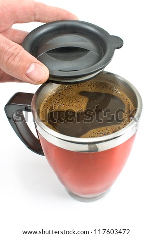 Red thermos with coffee drink and lid in hand isolated on white