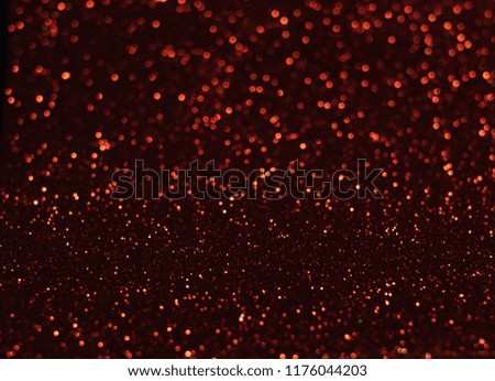 Red bokeh background, abstract with defocused lights.
