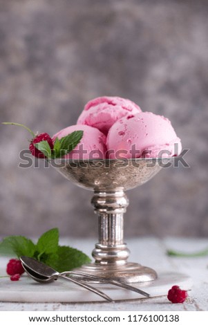 Variety of ice cream scoops in cones with mint, vanilla and strawberry