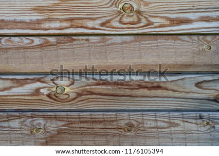 Wooden brown natural desks pattern. Closeup picture of old rustic wooden planks. Knots and long tree pattern.