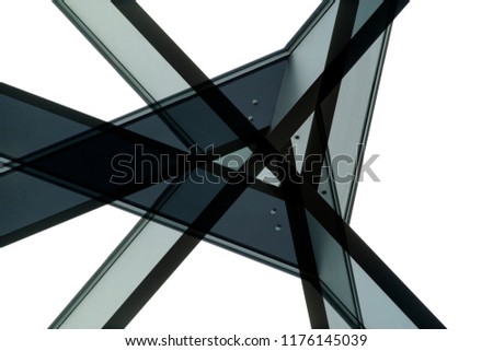 Modern architecture. Junction / nodal point of metal framework. Load-bearing structure. Close-up photo of industrial or office building fragment. Abstract construction industry background.