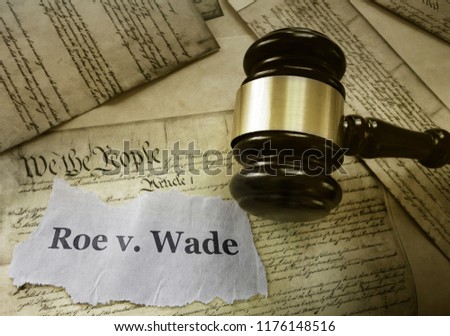  Roe v Wade news headline with gavel on a copy of the United States Constitution                               Royalty-Free Stock Photo #1176148516