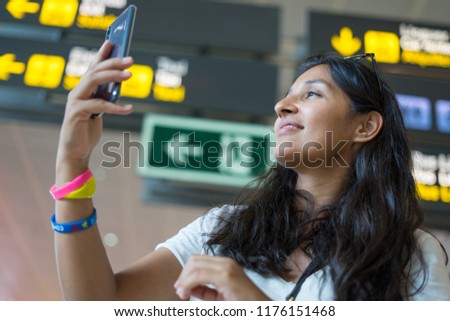 young woman taking a photo of herself