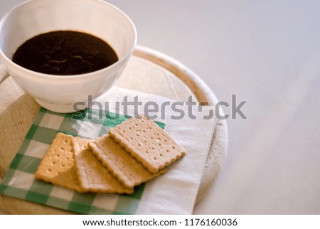 Hot chocolate cup with some biscuits to warm up in winter 
