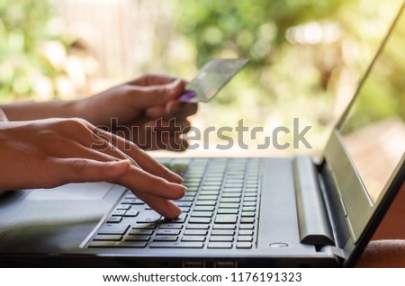 Online shopping and online banking and internet banking concept, Hand women with credit card on blurred background