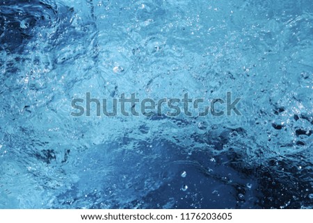 Surface of water, spray. Can be used as a background.