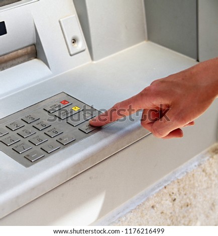 cash atm point dispenser with hand withdrawing money in town stock photography stock photo
