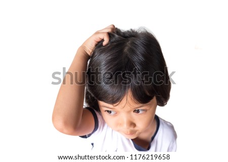 closeup asian girl head scratches caused by diseases of the scalp of children. it is lice and fungus on the scalp. cause itching and dirt. Shampoo product and medicine concept.