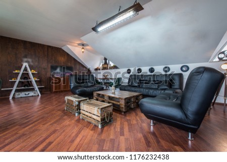 Leather black sofa in modern living room
