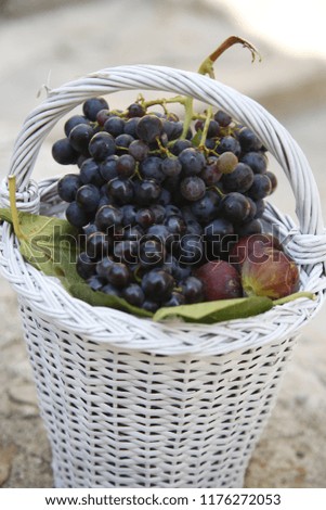 fresh grape  a basket on wooden background
