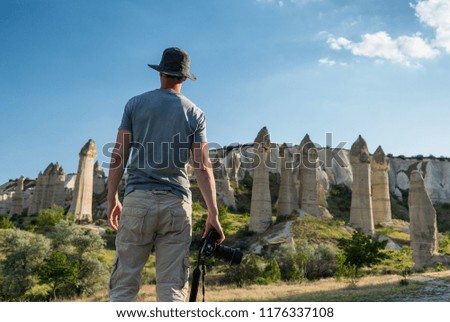 Photographer in mountains of Cappadocia