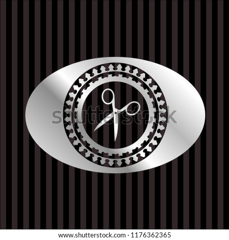 scissors icon inside silver shiny badge