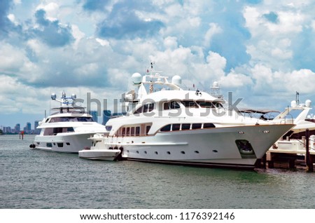 Luxury Motor Yachts Moored at Sunset Harbor in Miami Beach,Florida