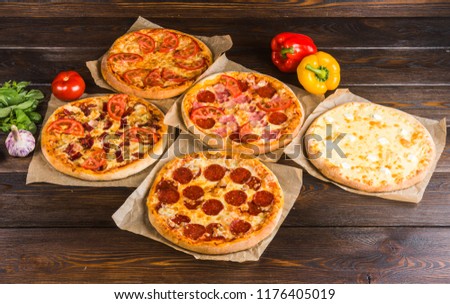 Small mini pizza (mini, miniature). Set of different mini pizzas Royalty-Free Stock Photo #1176405019