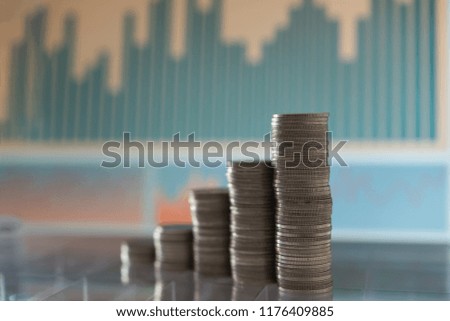 Invest money and finance concept. coins stack with spreadsheet research financial investing analysis report.