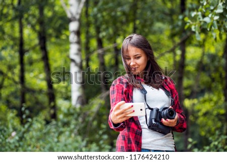 Young female photographer with dslr camera