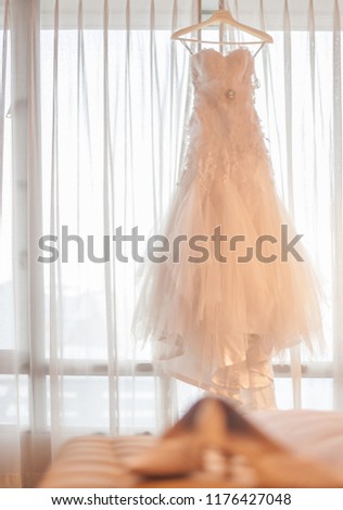 Elegant bridal gowns cut elegantly.
Hang on the glass and beautiful bridal shoes.
For a luxurious wedding
Perfect for a beautiful bride.
In the picture there is space for copy.