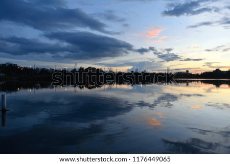 beautiful abstract artistic sunset sky on lake surface reflection as background