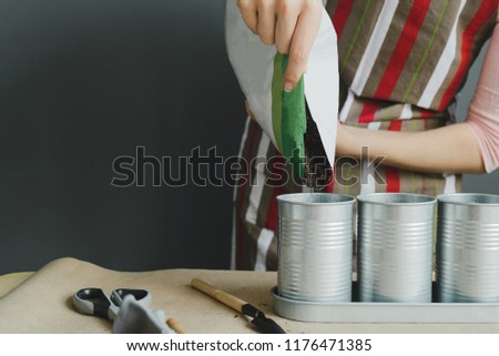 worker pours soil into flower pot, stock photo image