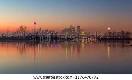 Toronto skyline as seen from the Leslie Street Spit at sunset on a winter evening