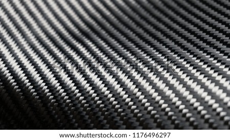 Material of composite product dark carbon fiber. woven cloth fabric for industry of automotive use for sport racing. dark tone texture background