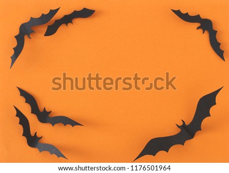 Halloween greeting card design, Paper Bats flying on orange background