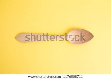 wooden spoon in color background