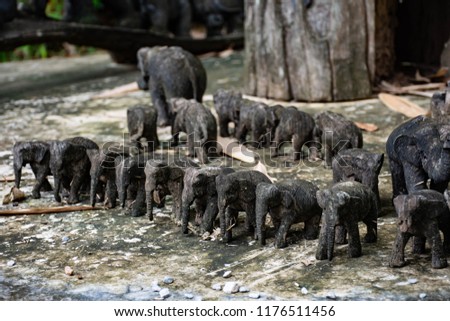 Elephants were carved out of wood.