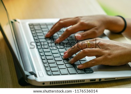 A girl using laptop doing online business from home.