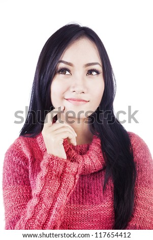 Asian woman is thinking of something isolated in white