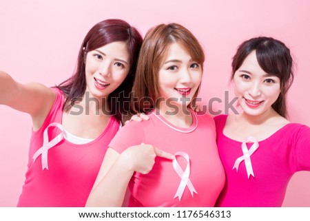 women selfie happily with breast cancer prevention on the pink background