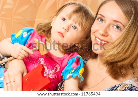 Smiling mother and daughter portrait