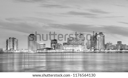 Downtown New Orleans, Louisiana and the Mississippi River at twilight in USA