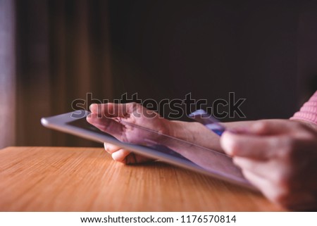 Woman Customer using Credit Card and Tablet to Shopping Online. Close-up shot and Selective focus