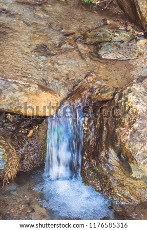 water flowing down rock