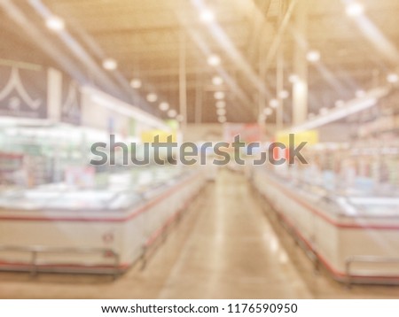 Abstract blurred of wholesale store. Blur of people in wholesale store with abstract bokeh light background. Wholesale store is a place to sell cheap for retailer.