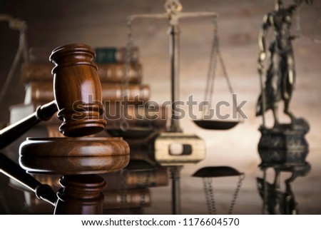 Law concept. Judge's gavel, statue of justice, scales, books, clock. Place for typography.