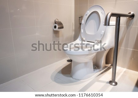 Toilet and handrail for elderly people at the toilet room in hospital, safty and medical concept Royalty-Free Stock Photo #1176610354