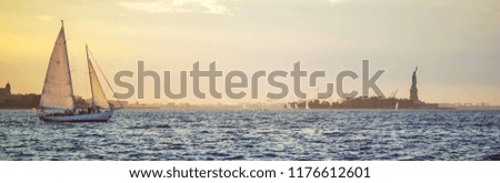 Website header and banner of calm sea with floating yachts and statue of liberty in background. Concept of USA landmarks, New York and America, cheap travel agency and tours.