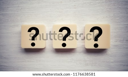 Question mark on alphabet block. Question mark over wooden background Royalty-Free Stock Photo #1176638581