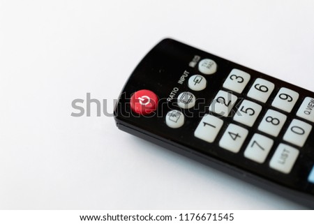 Remote controls tv on white background.