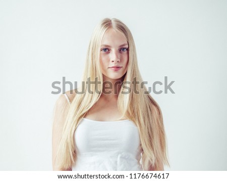 Young beautiful girl woman blonde long hair happy natural with beauty skin and eyes Royalty-Free Stock Photo #1176674617