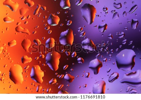 a lot of colorfull drops on window
