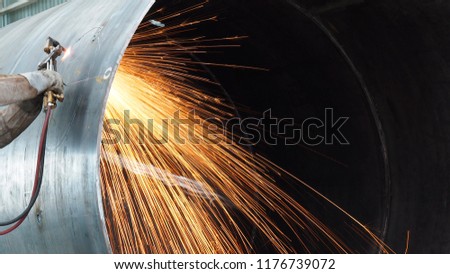 Gas cutting of steel with acetylene and oxygen , Industrial welding part in Oil and Gas or Petrochemical or Vessel  Royalty-Free Stock Photo #1176739072
