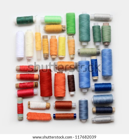 colored spools of threads Royalty-Free Stock Photo #117682039